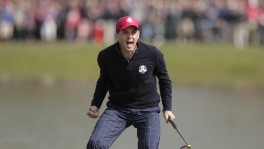 FILE - USA's Keegan Bradley celebrates after winning their foursomes match on the 15th hole at the Ryder Cup golf tournament, Friday, Sept. 28, 2012, at Medinah Country Club in Medinah, Ill. Bradley was selected as U.S. Ryder Cup captain for 2025, The PGA of America announced Monday, July 8, 2024. (AP Photo/Charlie Riedel, File)