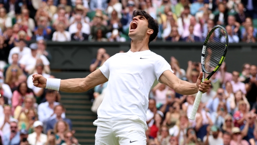 LONDON, ENGLAND - JULY 12: Carlos Alcaraz of Spain celebrates winning match point against Daniil Medvedev in the Men's Singles Semi-Final match during day twelve of The Championships Wimbledon 2024 at All England Lawn Tennis and Croquet Club on July 12, 2024 in London, England. (Photo by Sean M. Haffey/Getty Images)