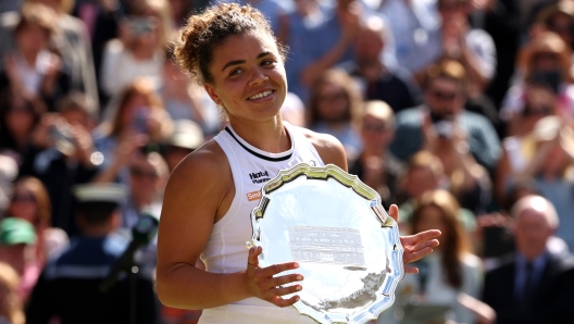 LONDON, ENGLAND - JULY 13: Jasmine Paolini of Italy poses with her Ladies' Singles Runner-Up Trophy following defeat against Barbora Krejcikova of Czechia in the Ladies' Singles Final match during day thirteen of The Championships Wimbledon 2024 at All England Lawn Tennis and Croquet Club on July 13, 2024 in London, England. (Photo by Julian Finney/Getty Images)