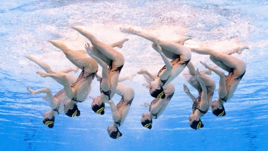 DOHA, QATAR - FEBRUARY 09: (EDITORS NOTE: Image taken using an underwater remote camera.) Linda Cerruti, Lucrezia Ruggiero, Marta Iacoacci, Isotta Sportelli, Sofia Mastroianni, Giulia Vernice, Enrica Piccoli and Francesca Zunino of Team Italy compete in the Mixed Team Free Final on day eight of the Doha 2024 World Aquatics Championships at Aspire Dome on February 09, 2024 in Doha, Qatar. (Photo by Quinn Rooney/Getty Images)