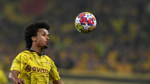 TOPSHOT - Dortmund's German forward #27 Karim Adeyemi heads the ball during the UEFA Champions League final football match between Borussia Dortmund and Real Madrid, at Wembley stadium, in London, on June 1, 2024. (Photo by Glyn KIRK / AFP)