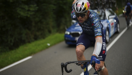 Belgium's Wout van Aert catches up with the pack during the fourteenth stage of the Tour de France cycling race over 151.9 kilometers (94.4 miles) with start in Pau and finish in Saint-Lary-Soulan Pla d'Adet, France, Saturday, July 13, 2024. (AP Photo/Daniel Cole)