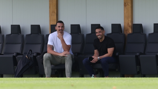 CAIRATE, ITALY - JULY 12: AC Milan Senior Advisor to Ownership Zlatan Ibrahimovic and AC Milan chief scout Geoffrey Moncada look on during the AC Milan training session at Milanello on July 12, 2024 in Cairate, Italy. (Photo by Claudio Villa/AC Milan via Getty Images)