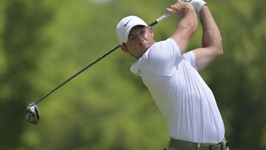 FILE - Rory McIlroy, of Northern Ireland, watches his tee shot on the fifth hole during the final round of the PGA Championship golf tournament at the Valhalla Golf Club, Sunday, May 19, 2024, in Louisville, Ky. McIlroy, who is from Northern Ireland, passed on golf's return to the Olympics in 2016 in part because of the pressure of deciding whether to play for Great Britain or Ireland. (AP Photo/Jon Cherry, File)