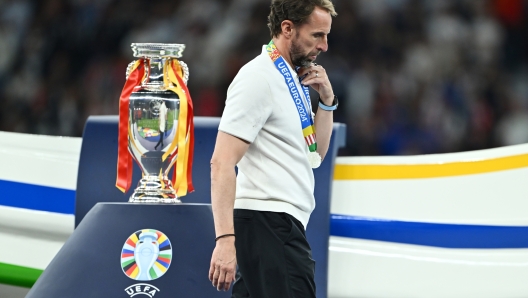 BERLIN, GERMANY - JULY 14: Gareth Southgate, Head Coach of England, walks past the UEFA Euro 2024 Henri Delaunay Trophy after defeat in the UEFA EURO 2024 final match between Spain and England at Olympiastadion on July 14, 2024 in Berlin, Germany. (Photo by Dan Mullan/Getty Images)