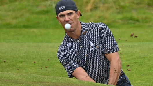 US golfer Billy Horschel plays from a bunker on the 14th hole during his third round, on day three of the 152nd British Open Golf Championship at Royal Troon on the south west coast of Scotland on July 20, 2024. (Photo by Glyn KIRK / AFP) / RESTRICTED TO EDITORIAL USE