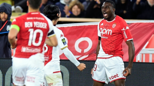 Monaco's French midfielder #19 Youssouf Fofana (R) celebrates with teammates after scoring his team's first goal during the French L1 football match between AS Monaco and Lille (LOSC) at the Louis II Stadium (Stade Louis II) in the Principality of Monaco on April 24, 2024. (Photo by Valery HACHE / AFP)