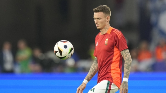 Scotland's Billy Gilmour warms up during a Group A match between Scotland and Hungary at the Euro 2024 soccer tournament in Stuttgart, Germany, Sunday, June 23, 2024. (AP Photo/Antonio Calanni)