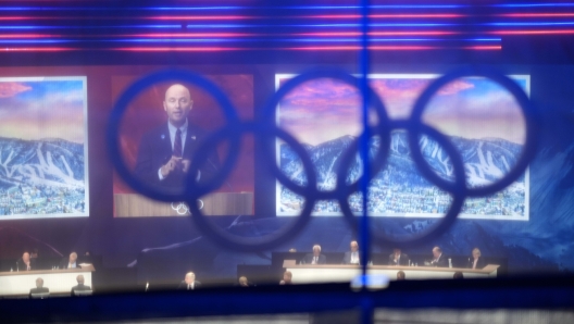 Utah Gov. Spencer Cox speaks about Salt Lake City's bid to host the 2034 Winter Olympics, during the 142nd IOC session at the 2024 Summer Olympics, Wednesday, July 24, 2024, in Paris, France. (AP Photo/David Goldman)