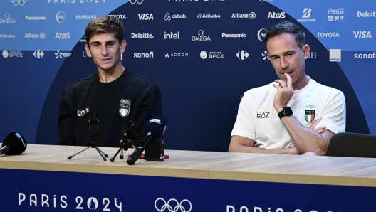 Filippo Volandri (R)  , head coach of italian tennis team  with tennis player Matteo Arnaldi attend the press conference at Roland Garros  stadium  Paris France  during  the Paris 2024 Olympic Games,  25 July 2024 ANSA / CIRO FUSCO