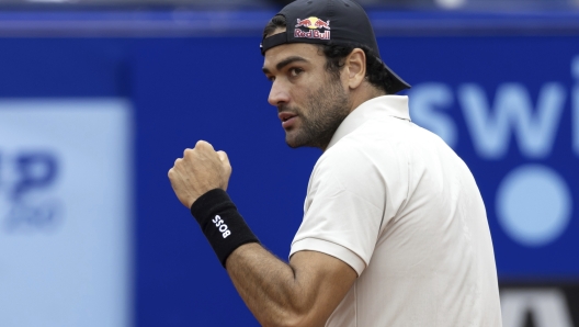 Italy's Matteo Berrettini celebrates making a point against France's Quentin Halys during the men's singles final of the Swiss Open tennis tournament in Gstaad, Switzerland, Sunday, July 21, 2024. (Peter Klaunzer/Keystone via AP)