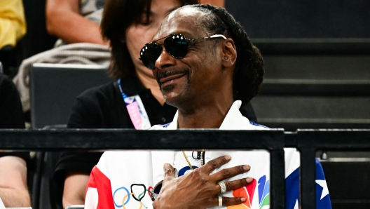 US singer Snoop Dogg attends the artistic gymnastics women's qualification during the Paris 2024 Olympic Games at the Bercy Arena in Paris, on July 28, 2024. (Photo by Loic VENANCE / AFP)