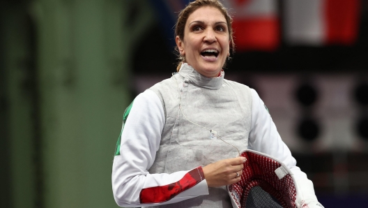 Italy's Arianna Errigo reacts as she competes against France's Eva Lacheray in the women's foil individual round of 16 bout during the Paris 2024 Olympic Games at the Grand Palais in Paris, on July 28, 2024. (Photo by Franck FIFE / AFP)