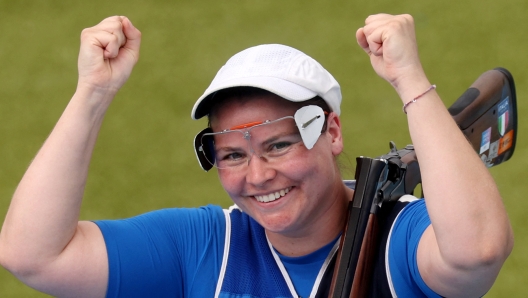 Silver medalist Italy's Silvana Maria Stanco celebrates at the end of the shooting trap men's final during the Paris 2024 Olympic Games at Chateauroux Shooting Centre on July 30, 2024. (Photo by Alain JOCARD / AFP)