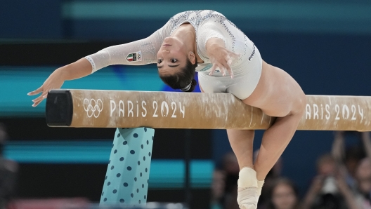 Manila Esposito, of Italy, performs on the balance beam during the women's artistic gymnastics team finals round at Bercy Arena at the 2024 Summer Olympics, Tuesday, July 30, 2024, in Paris, France. (AP Photo/Natacha Pisarenko)