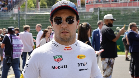 Red Bull driver Sergio Perez of Mexico ahead of the start of the Formula One Grand Prix at the Spa-Francorchamps racetrack in Spa, Belgium, Sunday, July 28, 2024. (AP Photo/Geert Vanden Wijngaert)