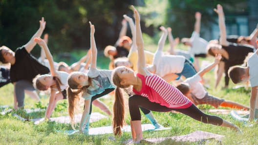 Yoga classes outside on the open air. Kids Yoga