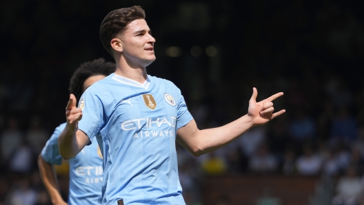 Manchester City's Julian Alvarez celebrates after scoring his side's fourth goal during the English Premier League soccer match between Fulham and Manchester City at the Craven Cottage Stadium in London, Saturday, May 11, 2024. (AP Photo/Kirsty Wigglesworth)