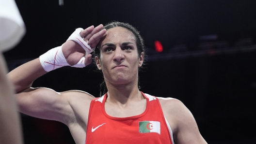 Algeria's Imane Khelif, celebrates after defeating Hungary's Anna Hamori in their women's 66kg quarterfinal boxing match at the 2024 Summer Olympics, Saturday, Aug. 3, 2024, in Paris, France. (AP Photo/John Locher)