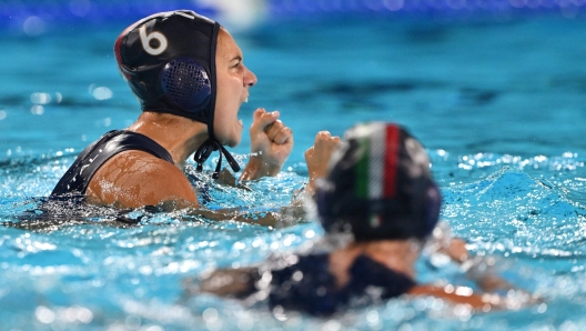 Italy's #06 Dafne Bettini celebrates after scoring in the women's water polo preliminary round group B match between Greece and Italy during the Paris 2024 Olympic Games at the Aquatics Centre in Saint-Denis, north of Paris, on August 2, 2024. (Photo by Andreas SOLARO / AFP)