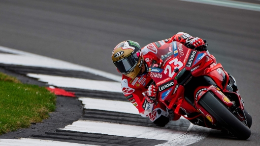 Ducati Lenovo Team's Italian rider Enea Bastianini takes part in a warm-up ahead of the MotoGP race of British Grand Prix at Silverstone circuit in Northamptonshire, central England, on August 4, 2024. (Photo by BENJAMIN CREMEL / AFP)