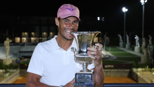 ROME, ITALY - MAY 16:  Rafael Nadal of Spain celebrates with the trophy after winning the final over Novak Djokovic of Serbia during the men's final at Foro Italico on May 16, 2021 in Rome, Italy. (Photo by Clive Brunskill/Getty Images)