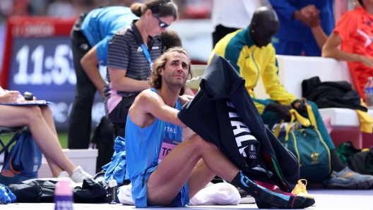 PARIS, FRANCE - AUGUST 07: Gianmarco Tamberi of Team Italy shows his dejection after competing in the Men's High Jump Qualification on day twelve of the Olympic Games Paris 2024 at Stade de France on August 07, 2024 in Paris, France. (Photo by Michael Steele/Getty Images)