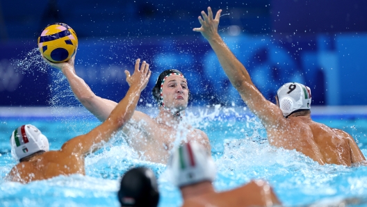 NANTERRE, FRANCE - AUGUST 07: Krisztian Manhercz of Team Hungary shoots in the Men's Quarterfinal match between Team Italy and Team Hungary on day twelve of the Olympic Games Paris 2024 at Paris La Defense Arena on August 07, 2024 in Nanterre, France. (Photo by Quinn Rooney/Getty Images)