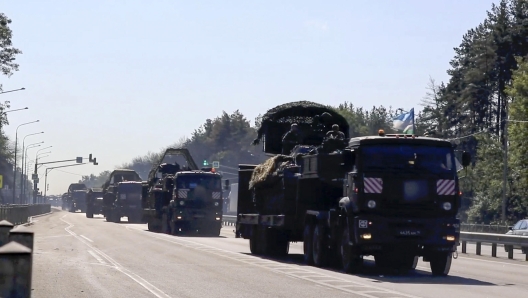 epa11542392 A still image taken from a handout video provided on 10 August 2024 by the Russian Defence Ministry shows Russian troops delivering military equipment to the Kursk region, Russia. According to Andrei Belostotsky, acting deputy governor of the Kursk region, over 3,000 civilians were evacuated from border areas as a result of attacks by the Ukrainian Armed Forces in the Kursk region that started on 06 August. On 10 August the Russian Defense Ministry reported that tank units had taken up positions in Kursk Oblast to fight the Ukrainian Armed Forces. The National Anti-Terrorism Committee confirmed the enforcement of a counter-terrorism operation (CTO) in the Kursk, Belgorod and Bryansk regions.  EPA/RUSSIAN DEFENCE MINISTRY HANDOUT HANDOUT EDITORIAL USE ONLY/NO SALESHANDOUT EDITORIAL USE ONLY/NO SALES