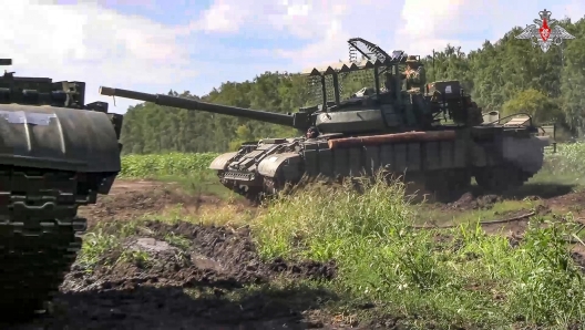 In this photo taken from video released by the Russian Defense Ministry on Saturday, Aug. 10, 2024, Russian Army tanks take a position at an area of ??Kursk region of Russia. (Russian Defense Ministry Press Service via AP)