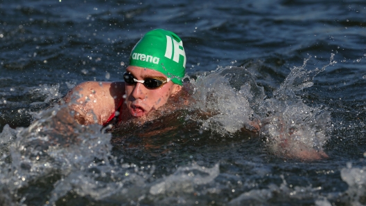 PARIS, FRANCE - AUGUST 09: Daniel Wiffen of Team Ireland competes in the Marathon Swimming Men's 10k on day fourteen of the Olympic Games Paris 2024 at Pont Alexandre III on August 09, 2024 in Paris, France. (Photo by Luke Hales/Getty Images)