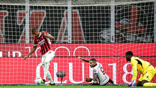 AC Milan's German defender #28 Malick Thiaw scores an own goal during the Italian Serie A football match between AC Milan and Torino at the San Siro Stadium in Milan, on August 17, 2024. (Photo by Piero CRUCIATTI / AFP)