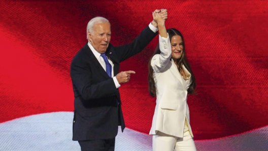 President Joe Biden, left, joins his daughter Ashley Biden on stage prior to delivering a speech during the Democratic National Convention, Monday, Aug. 19, 2024, in Chicago. (Yalonda M. James/San Francisco Chronicle via AP)