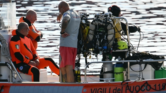 Divers of the Vigili del Fuoco, the Italian Corps. of Firefighters leave Porticello harbor near Palermo, to resume research for a last missing person on August 23, 2024, four days after the British-flagged luxury yacht Bayesian sank. The body of UK tech tycoon Mike Lynch was recovered on August 22, 2024 from his sunken yacht off Sicily, as the search continued for the last of the six people missing. The Bayesian, which had 22 people aboard including 10 crew, was anchored some 700 metres from port before dawn when it was struck by a waterspout. Among the six missing were UK tech entrepreneur Mike Lynch and his 18-year-old daughter Hannah, and Jonathan Bloomer, the chair of Morgan Stanley International, and his wife Judy. (Photo by Alberto PIZZOLI / AFP)