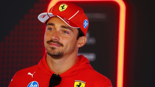 ZANDVOORT, NETHERLANDS - AUGUST 22: Charles Leclerc of Monaco and Ferrari talks to the media in the Paddock during previews ahead of the F1 Grand Prix of Netherlands at Circuit Zandvoort on August 22, 2024 in Zandvoort, Netherlands. (Photo by Clive Rose/Getty Images)