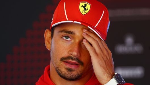 ZANDVOORT, NETHERLANDS - AUGUST 22: Charles Leclerc of Monaco and Ferrari talks to the media in the Paddock during previews ahead of the F1 Grand Prix of Netherlands at Circuit Zandvoort on August 22, 2024 in Zandvoort, Netherlands. (Photo by Clive Rose/Getty Images)