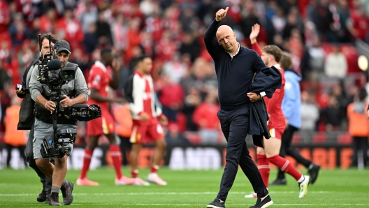 LIVERPOOL, ENGLAND - AUGUST 25: Arne Slot, Manager of Liverpool, acknowledges the fans after the team's victory in the Premier League match between Liverpool FC and Brentford FC at Anfield on August 25, 2024 in Liverpool, England. (Photo by Michael Regan/Getty Images)