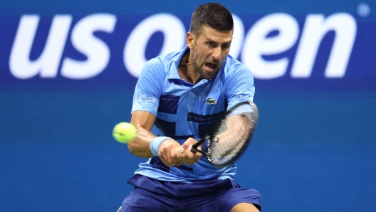 NEW YORK, NEW YORK - AUGUST 26: Novak Djokovic of Serbia returns against Radu Albot of Moldova during their Men's Singles First Round match on Day One of the 2024 US Open at the USTA Billie Jean King National Tennis Center on August 26, 2024 in the Flushing neighborhood of the Queens borough of New York City.   Luke Hales/Getty Images/AFP (Photo by Luke Hales / GETTY IMAGES NORTH AMERICA / Getty Images via AFP)