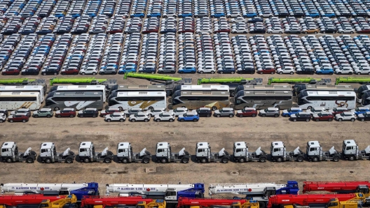 This photo taken on May 8, 2024 shows vehicles for export waiting to be loaded onto a ship at Yantai Port in Yantai, in China's eastern Shandong Province. (Photo by AFP) / China OUT