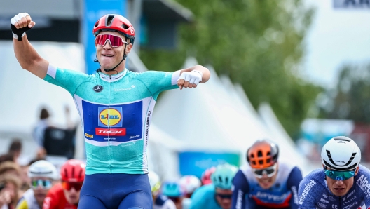 Lidl-Trek team's Italian rider Jonathan Milan (L) celebrates as he crosses the finish line to win the third stage of the "Renewi Tour" multi-stage cycling race, 185,5 km from Blankenberge to Ardooie on August 30, 2024. (Photo by DAVID PINTENS / Belga / AFP) / Belgium OUT