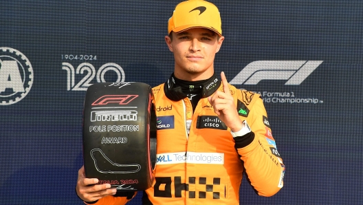 McLaren's British driver Lando Norris celebrates his pole position after the qualifying session, ahead of the Italian Formula One Grand Prix at Autodromo Nazionale Monza circuit, in Monza on August 31, 2024. (Photo by MASSIMO PINCA / POOL / AFP)