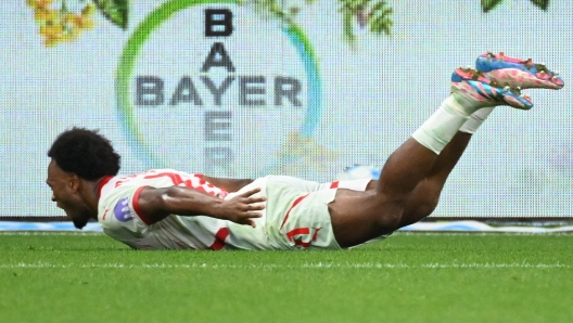 Leipzig's Belgian forward #11 Lois Openda celebrates scoring the 2-3 goal during the German first division Bundesliga football match between Bayer 04 Leverkusen and RB Leipzig in Leverkusen, southwestern Germany on August 31, 2024. (Photo by UWE KRAFT / AFP) / DFL REGULATIONS PROHIBIT ANY USE OF PHOTOGRAPHS AS IMAGE SEQUENCES AND/OR QUASI-VIDEO