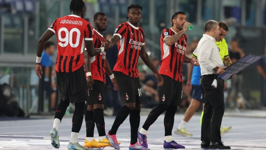 ROME, ITALY - AUGUST 31:  Tammy Abraham of AC Milan reacts with Rafael Leao during the Serie A match between Lazio and Milan at Stadio Olimpico on August 31, 2024 in Rome, Italy. (Photo by Claudio Villa/AC Milan via Getty Images)