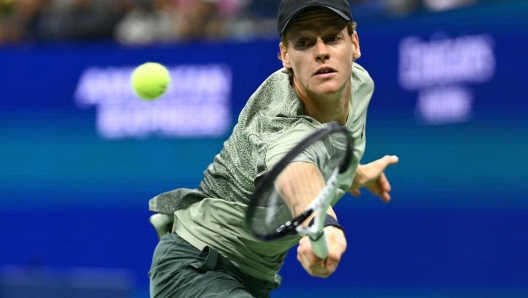 Italy's Jannik Sinner hits a return to USA's Tommy Paul during their men's singles round of 16 match on day eight of the US Open tennis tournament at the USTA Billie Jean King National Tennis Center in New York City, on September 2, 2024. (Photo by ANGELA WEISS / AFP)