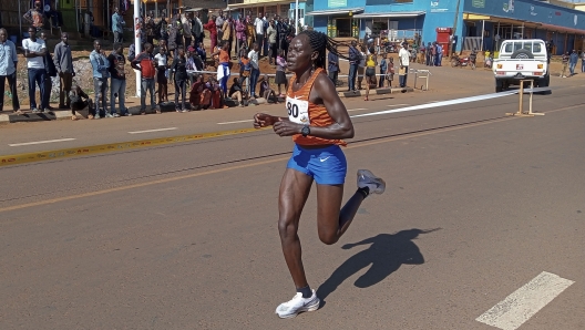 Rebecca Cheptegei, competes at the Discovery 10km road race in Kapchorwa, Uganda Friday, Jan. 20, 2023. A Cheptegei, a Ugandan athlete living in Kenya was set ablaze by her boyfriend on Sunday Sept. 1, 2024 and is currently receiving treatment for 75% burns, police said. (AP Photo)