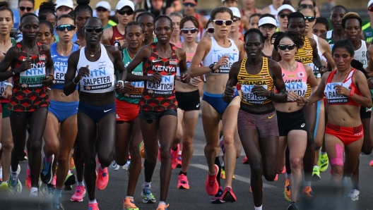 (From L to R) Kenya's Rosemary Wanjiru, Italy's Giovanna Epis, Israel's Lonah Chemtai Salpeter, Ethiopia's Gotytom Gebreslase, Kenya's Selly Chepyego Kaptich, USA's Lindsay Flanagan, Uganda's Rebecca Cheptegei, Japan's Rika Kaseda and Peru's Zaida Ramos compete in the women's marathon final during the World Athletics Championships in Budapest on August 26, 2023. (Photo by Ferenc ISZA / AFP)