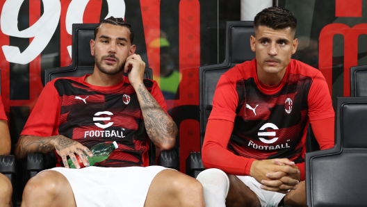 MILAN, ITALY - AUGUST 17: Theo Hernandez and Alvaro Morata of AC Milan look on from the substitute bench prior to the Serie match between AC Milan and Torino at Stadio Giuseppe Meazza on August 17, 2024 in Milan, Italy. (Photo by Marco Luzzani/Getty Images)