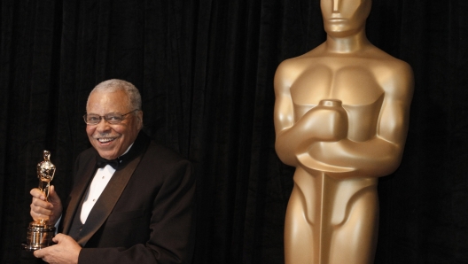 FILE - James Earl Jones poses with his honorary Oscar at the 84th Academy Awards on Sunday, Feb. 26, 2012, in the Hollywood section of Los Angeles. Jones, who overcame racial prejudice and a severe stutter to become a celebrated icon of stage and screen has died at age 93, Monday, Sept. 9, 2024. (AP Photo/Chris Carlson, File)