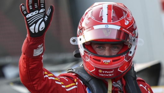 epa11603776 Monaco's driver Charles Leclerc of Scuderia Ferrari celebrates his pole position after the qualifying for the 2024 Formula One Grand Prix of Azerbaijan, at the Baku City Circuit in Baku, Azerbaijan, 14 September 2024. The Formula One Grand Prix of Azerbaijan will take place on 15 September 2024.  EPA/ALI HAIDER