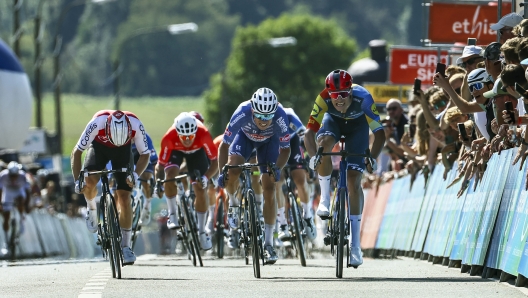 Italian Jonathan Milan of Lidl-Trek (R) wins the sprint, before Belgian Jasper Philipsen of Alpecin-Deceuninck (C) and French Axel Zingle of Cofidis (L), at the finish of the first stage of the 'Renewi Tour' multi-stage cycling race, from Riemst to Bilzen (163,6 km) on August 28, 2024. The five-day race takes place in Belgium and the Netherlands. (Photo by DAVID PINTENS / Belga / AFP) / Belgium OUT